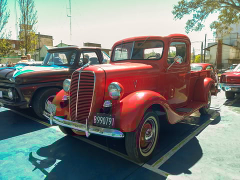 Old shiny red 1937 Ford V8 pickup truck