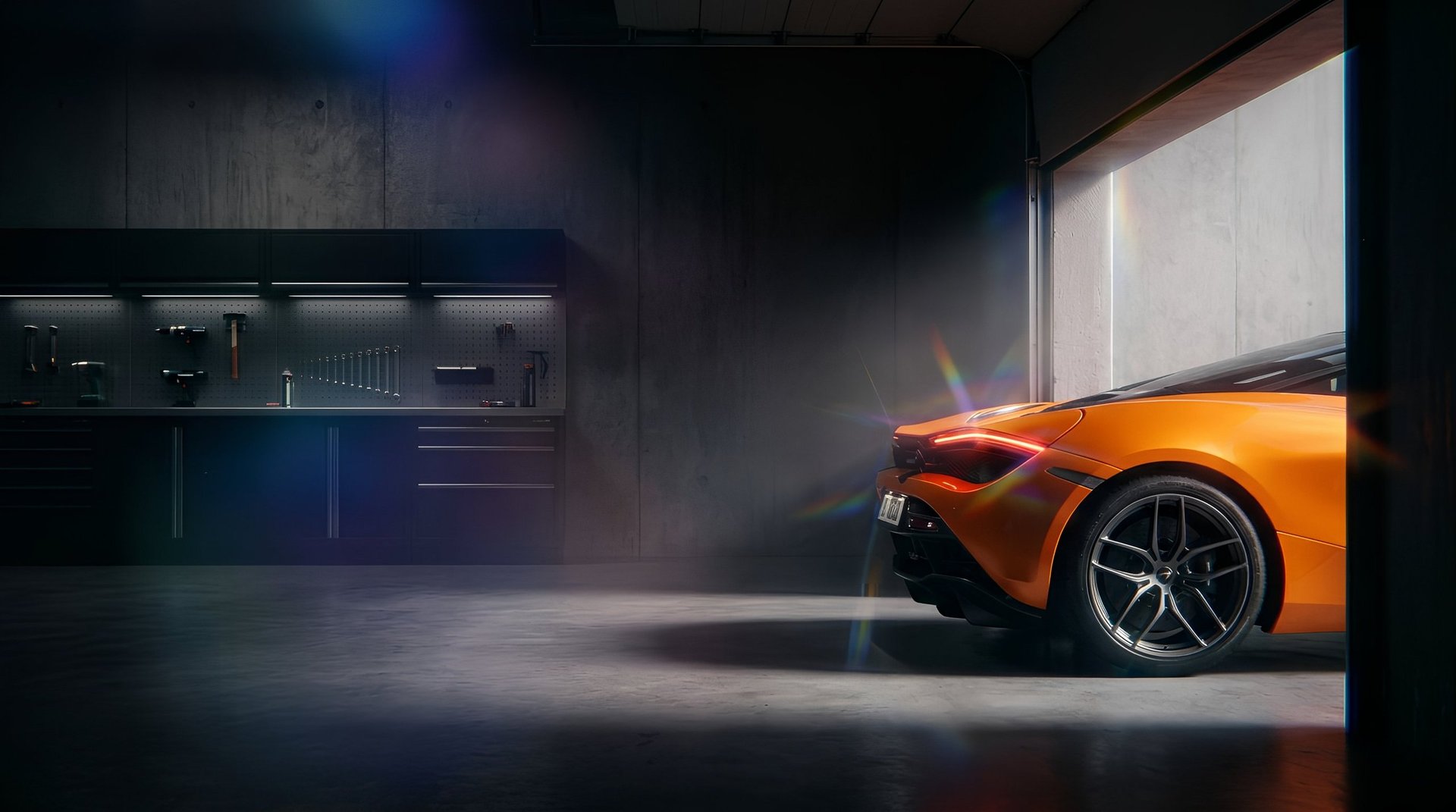 Orange sports car in modern garage with dramatic lighting and industrial interior